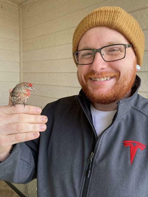 man in hat holding a bird perched on his finger, Uplifting wholesome images, nice pictures of animals and people, humanity restored, wholesome pics, reddit, r wholesome, funny cute animals, feeling good